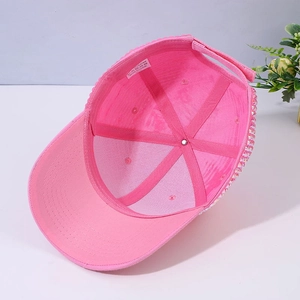 Detailed interior of the pink rhinestone baseball cap showing six-panel stitching and sweatband