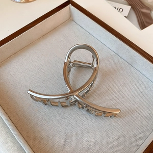 Silver minimalist irregular geometric metal shark hair claw clip on jewelry tray
