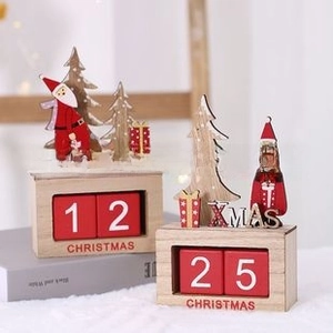 Handcrafted wooden Christmas countdown calendar with Santa Claus and red date blocks
