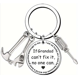 Detail of silver stainless steel keychain with mini hammer, wrench and screwdriver charms
