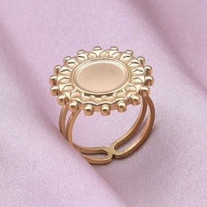 Detailed macro view of an 18K gold-plated adjustable ring base with a sunburst setting
