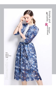 Detailed close-up of blue floral lace dress with vintage white stand collar and embroidery