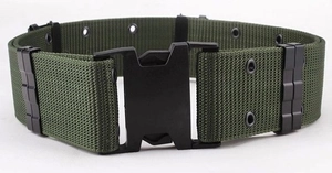 Detail of military green tactical canvas belt with black plastic buckle and metal eyelets