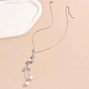 Long leaf sweater necklace with sparkling rhinestones and elegant white pearls