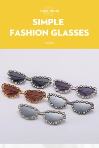 Macro shot of oversized butterfly cat-eye sunglasses with luxury rhinestone embellished frames