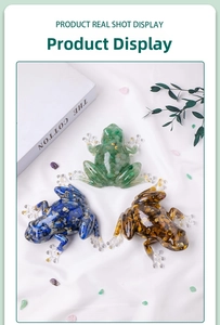 Detailed top view of three resin frog figurines filled with colorful natural crystals