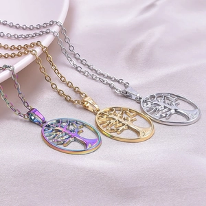 Three Tree of Life pendants in rainbow, gold, and silver on delicate metal chains
