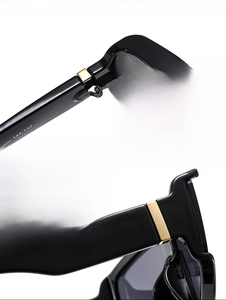 Macro shot of durable metal hinges and black frame detail for premium sunglasses