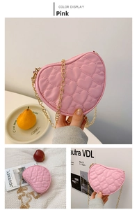 Detailed view of pink heart-shaped crossbody bag with quilted PU leather and gold chain