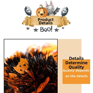 Detail of Halloween tinsel garland in orange and black with pumpkin cutout accents