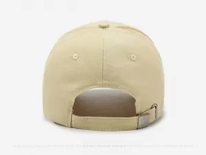 Detail view of khaki cotton baseball cap back with adjustable metal buckle and engraving