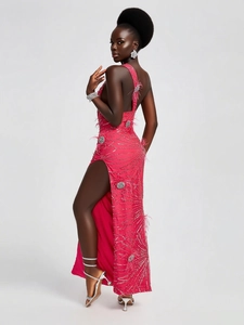 Elegant hot pink sequined evening gown with feather trim and high side slit