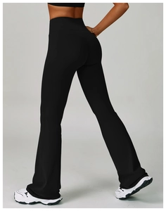 Detailed back view of high-waisted yoga flare pants showing butt-lifting seam and slit hem