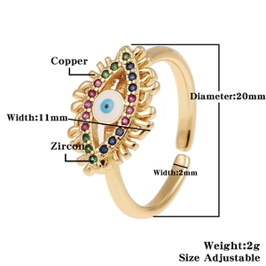 Detail of adjustable copper evil eye ring with colorful zircon and enamel inlay