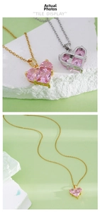 Detail view of heart-shaped pink gem pendant necklace with gold and silver chains