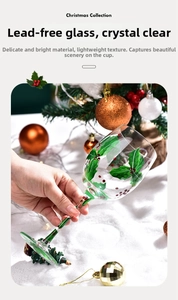 Macro shot of lead-free glass wine cup with hand-painted holly and berries patterns