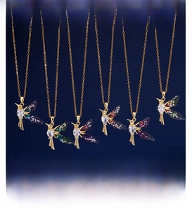 Detailed view of hummingbird pendant necklaces with colorful gradient wings and crystals