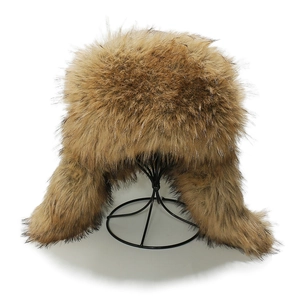 Detailed view of thick brown faux fox fur and suede texture on the warm Ushanka hat