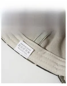 Macro detail of 100% cotton washed camouflage cap with wide moisture-wicking sweatband