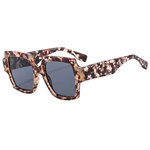 Oversized square tortoise shell sunglasses with dark grey lenses in a 45-degree view