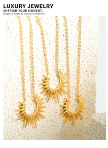Macro shot of three gold plated titanium steel necklaces with radiant sunburst pendants