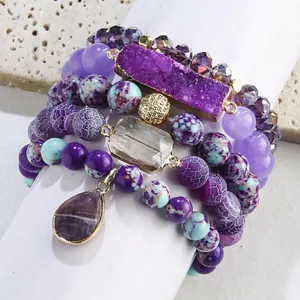 Bohemian stackable bracelet set with purple crystals and natural stone beads in gold finish