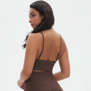 Detail view of coffee ribbed workout set featuring adjustable straps and seamless fit