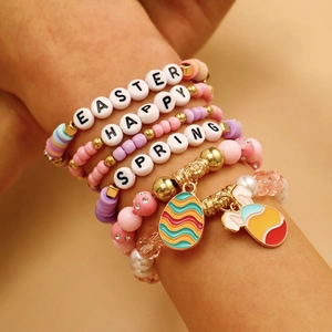 Handmade Easter bead bracelet set featuring bunny charms and colorful clay disc beads