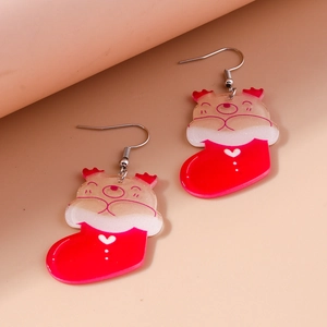 Detail shot of Christmas bear in stocking earrings with red and cream festive patterns