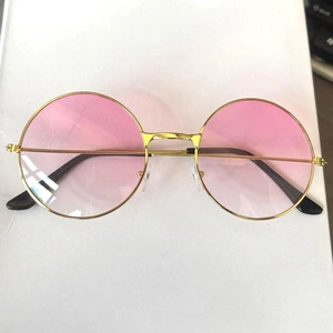 Detail view of retro round sunglasses with gold metal frame and pink gradient lenses