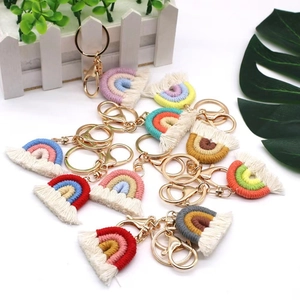 Handmade woven rainbow keychain with gold metal clasp in various colorful cotton designs