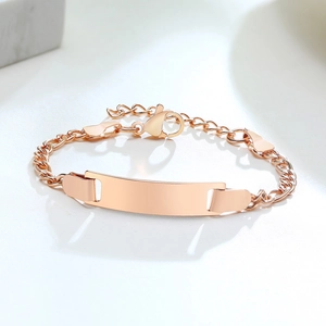 Detail shot of rose gold stainless steel ID bracelet with adjustable chain and lobster clasp