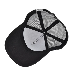 Detail view of the interior stitching, sweatband, and mesh fabric on the trucker hat
