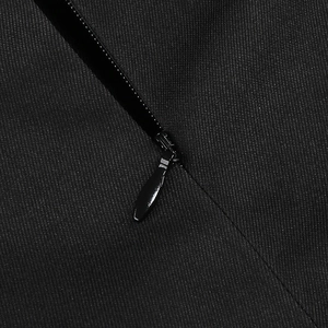 Macro shot of invisible zipper and twill fabric texture on a sexy black jumpsuit