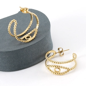 Boucles d'oreilles doubles anneaux en acier inoxydable doré 18K avec motif œil