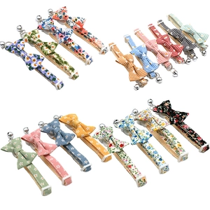 Adjustable floral and plaid pet collars with bows and bells for cats and dogs