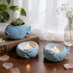 Fish-shaped light blue ceramic candle holder and succulent planter set with scale texture