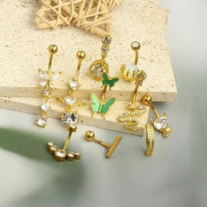 Detailed display of gold belly rings featuring zircon hearts, butterflies and snake motifs
