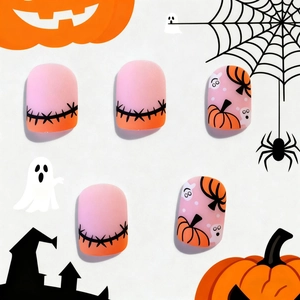 Short square Halloween press-on nails with matte pumpkin and ghost designs on pink gradient