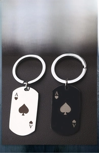 Ace of Spades stainless steel keychains in silver and gun black finishes on leather