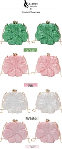 Detail of flower-shaped acrylic evening bags in green, pink, white with gold chain straps