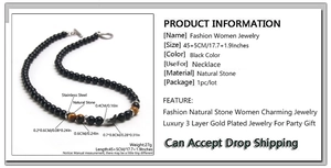 Detail view of obsidian and tiger eye beaded necklace with size markers and OT clasp