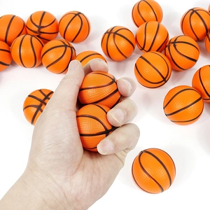 Close-up of squeezing a small orange foam basketball toy to show soft PU material texture