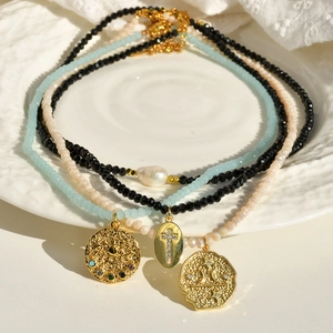 Three-piece layered beaded necklace set with baroque pearls and gold star pendants