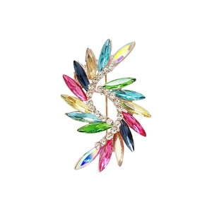 Fashionable crystal glass brooch pin with multicolored crystals on a gold spiral metal base