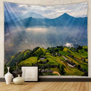 Detail of bohemian landscape tapestry showing misty mountains and green rice terraces