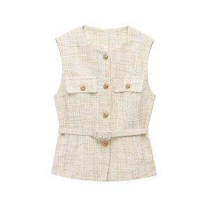 Close-up of beige tweed vest with gold texture buttons and matching waist belt detail