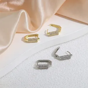 U-shaped earrings with micro-pave crystals in gold and silver luxury finish