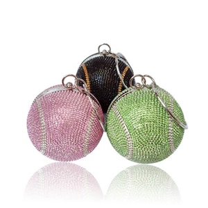 Macro detail of round rhinestone evening bags in tennis style with silver ring handles