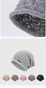 Close-up of cable knit texture and fabric detail on a warm winter slouchy beanie